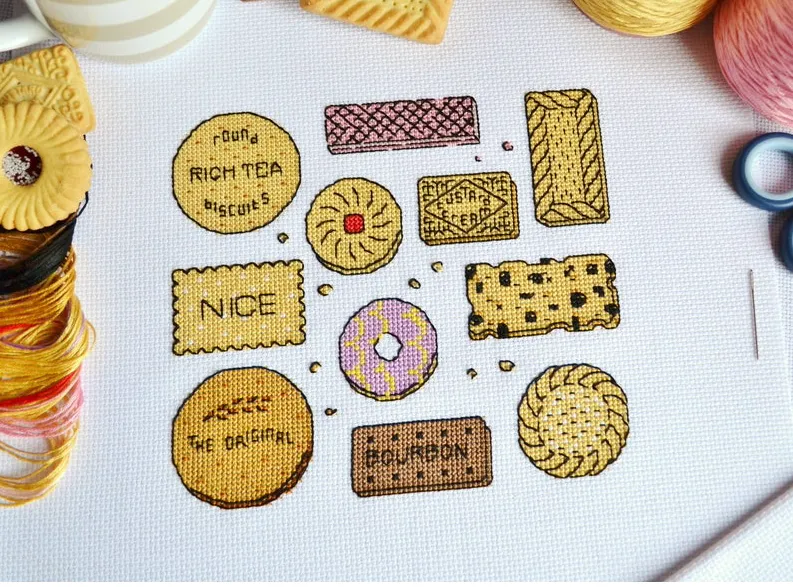 Lots of deliciously bright crossed stitched biscuits stitched on aida fabric - I can spot jammie dodgers Nice, digestive, shortcake, garibaldi squared fly, pink wafer, bourbon. Clearly I have spend too much time studying the field of biscuit. Or not, time well spent.