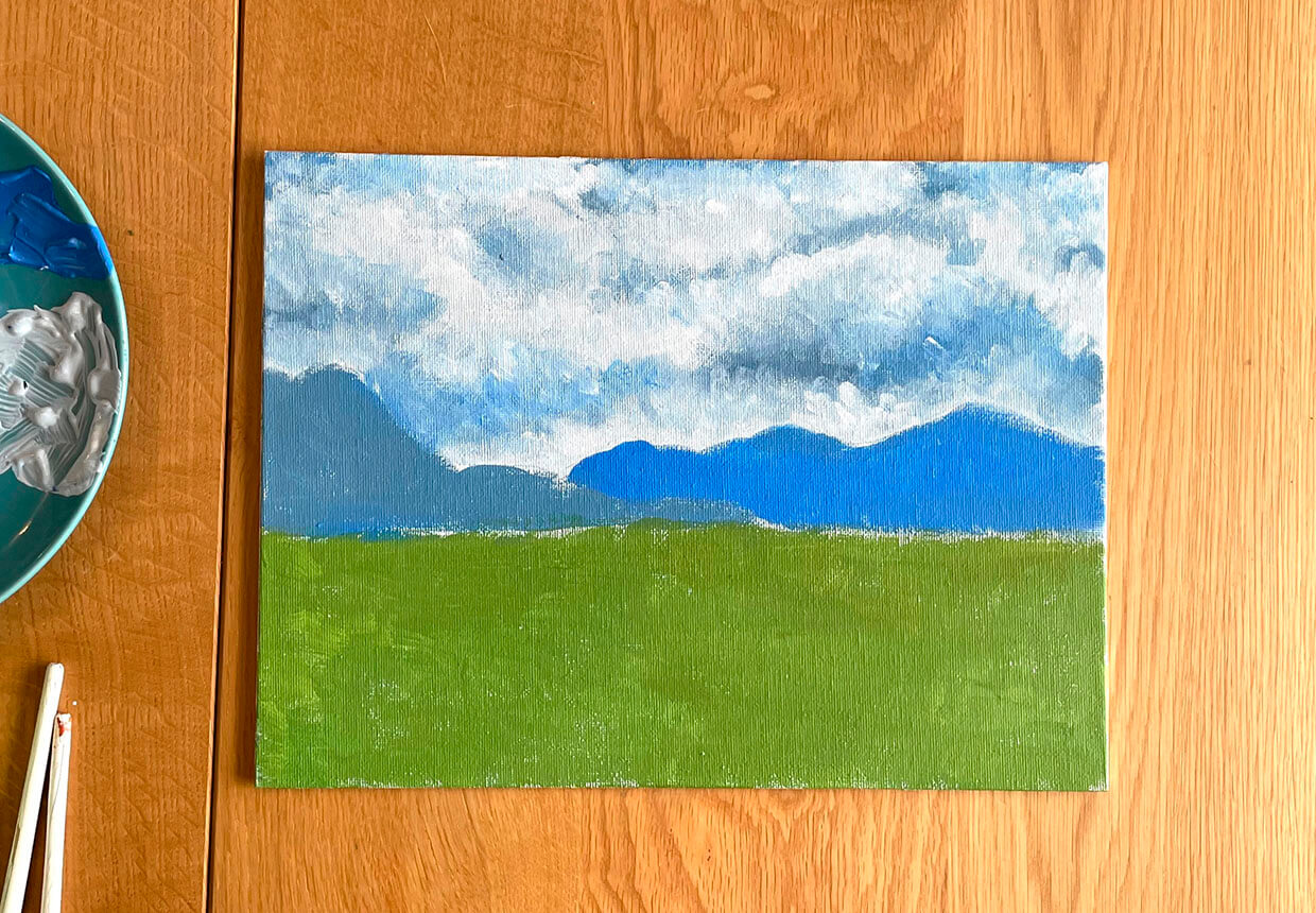 Acrylic landscape painting step five – adding the clouds