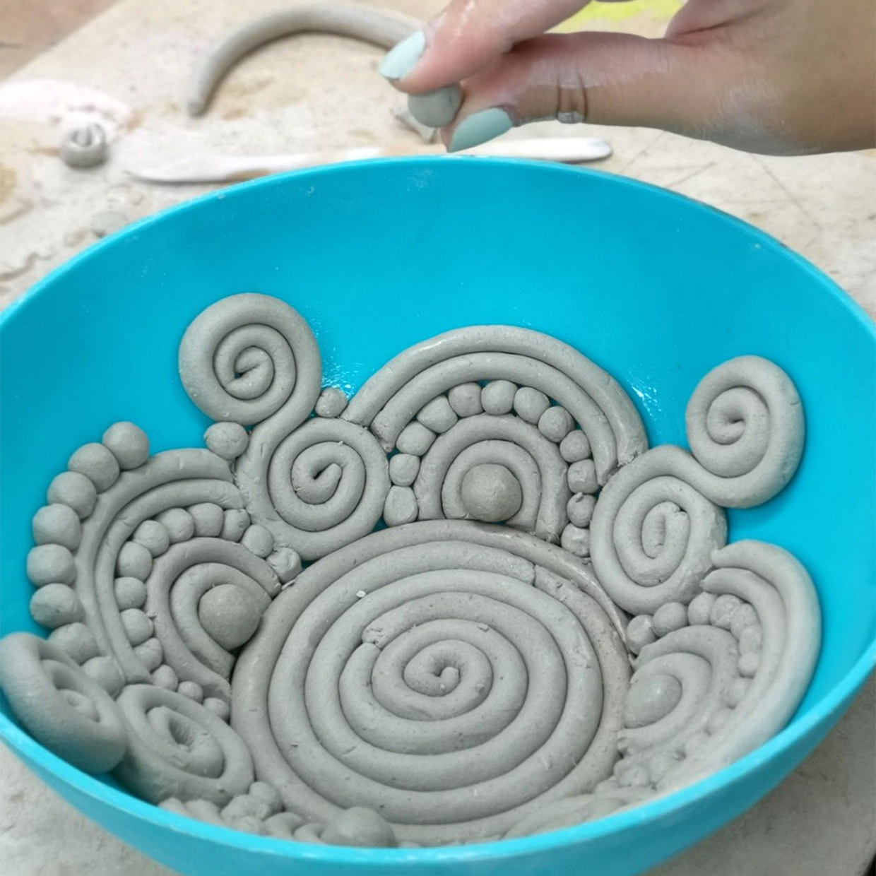 Coil pottery with a mould designs