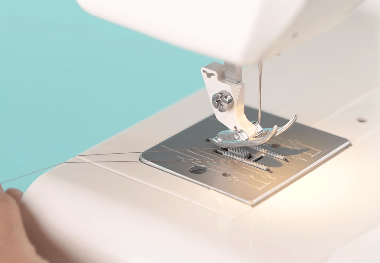 How to thread a sewing machine needle step 7