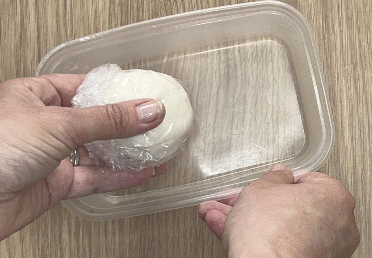 air dry clay wrapped in cling film in an airtight container