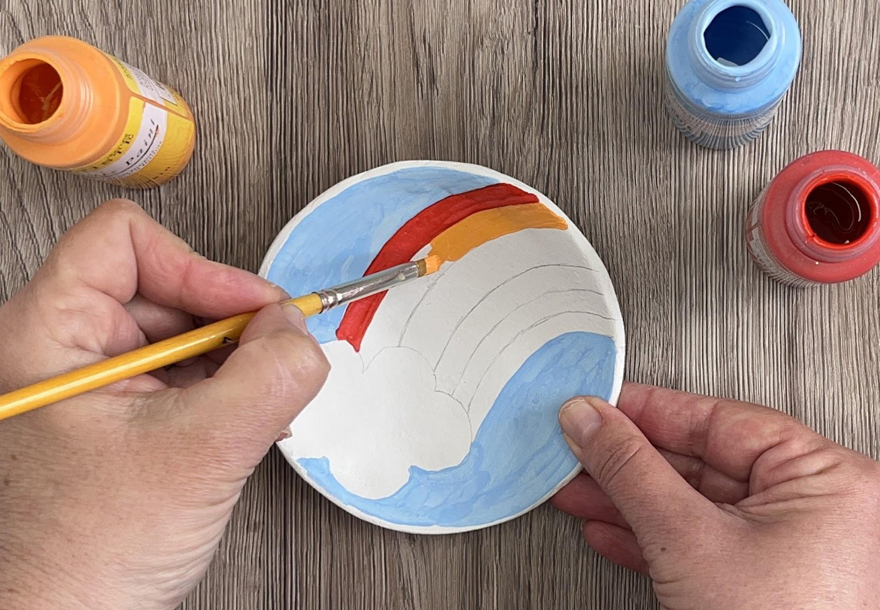 painting your air dry clay with a rainbow design