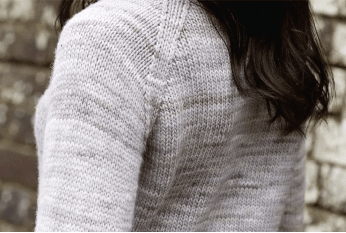 Close up of shoulder of a knitted jumper demonstrating wrapless short rows