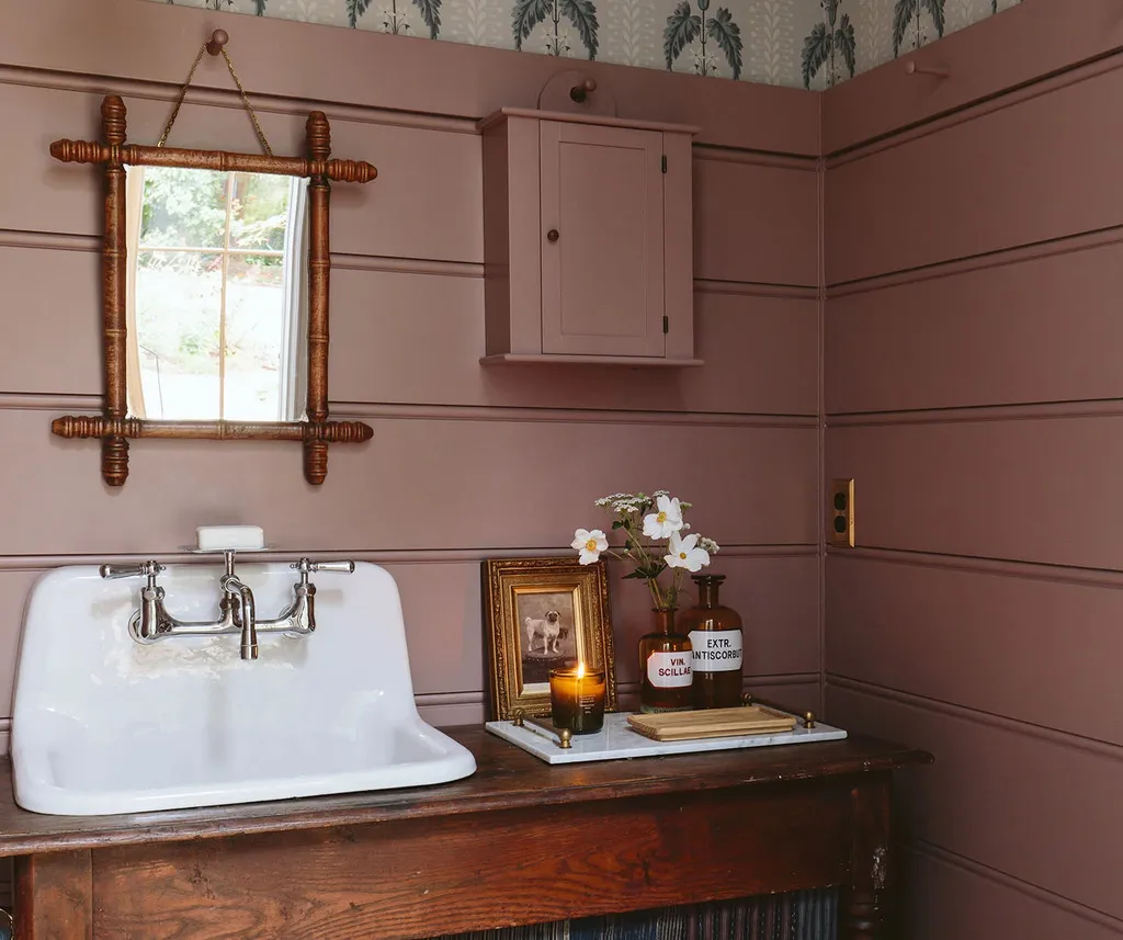 Pink horizontal tongue and groove in a bathroom