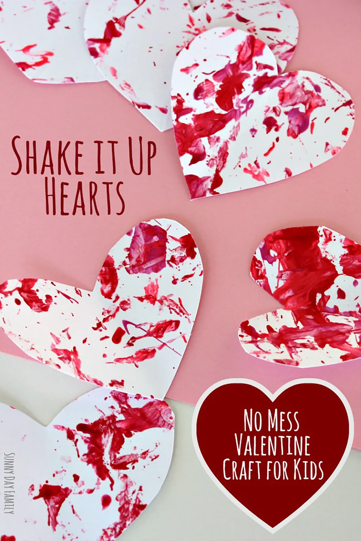 Paper hearts splashed with red paint - valentines crafts for kids