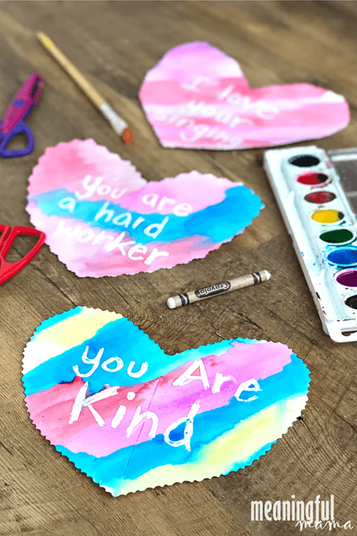 A paper heart with the a message written on it which says 'you are kind' - valentines crafts for kids