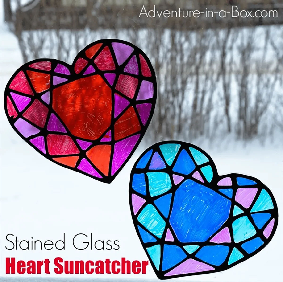 Two stained glass hearts hanging in a window - valentines crafts for kids