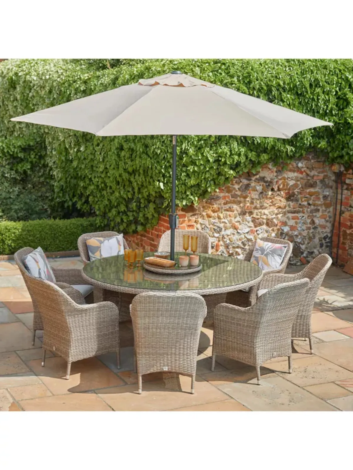 Large round garden table and eight chairs with parasol
