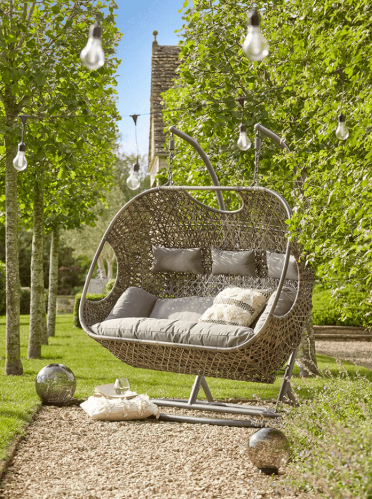 Rattan swing seat that can fit three people at a time