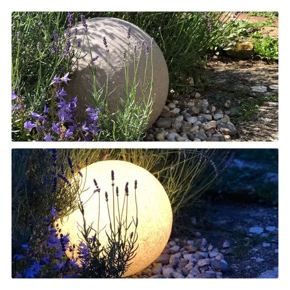 A stone-effect globe shown in daylight and all lit up at night