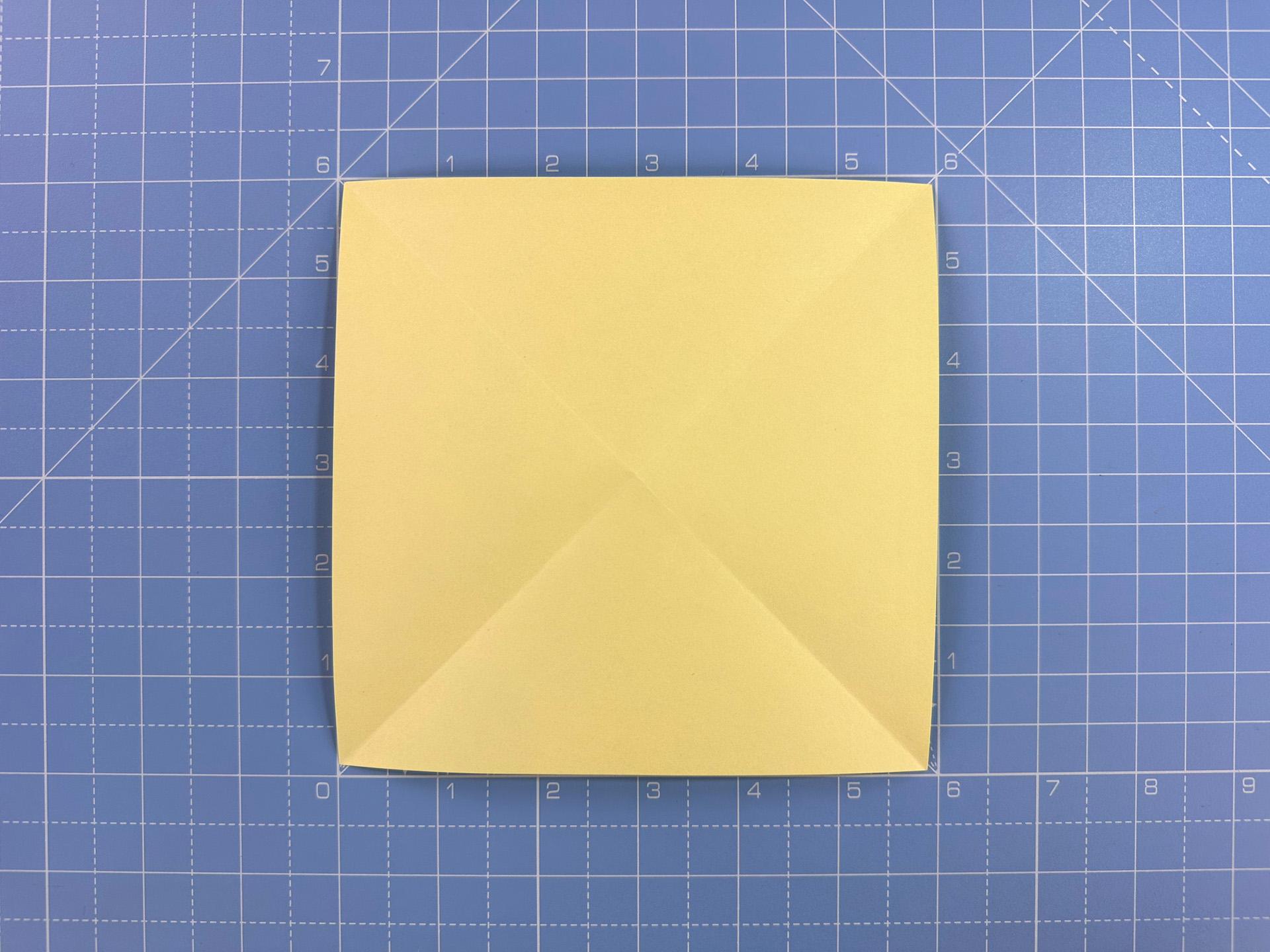 Making an origami flower bud step 12