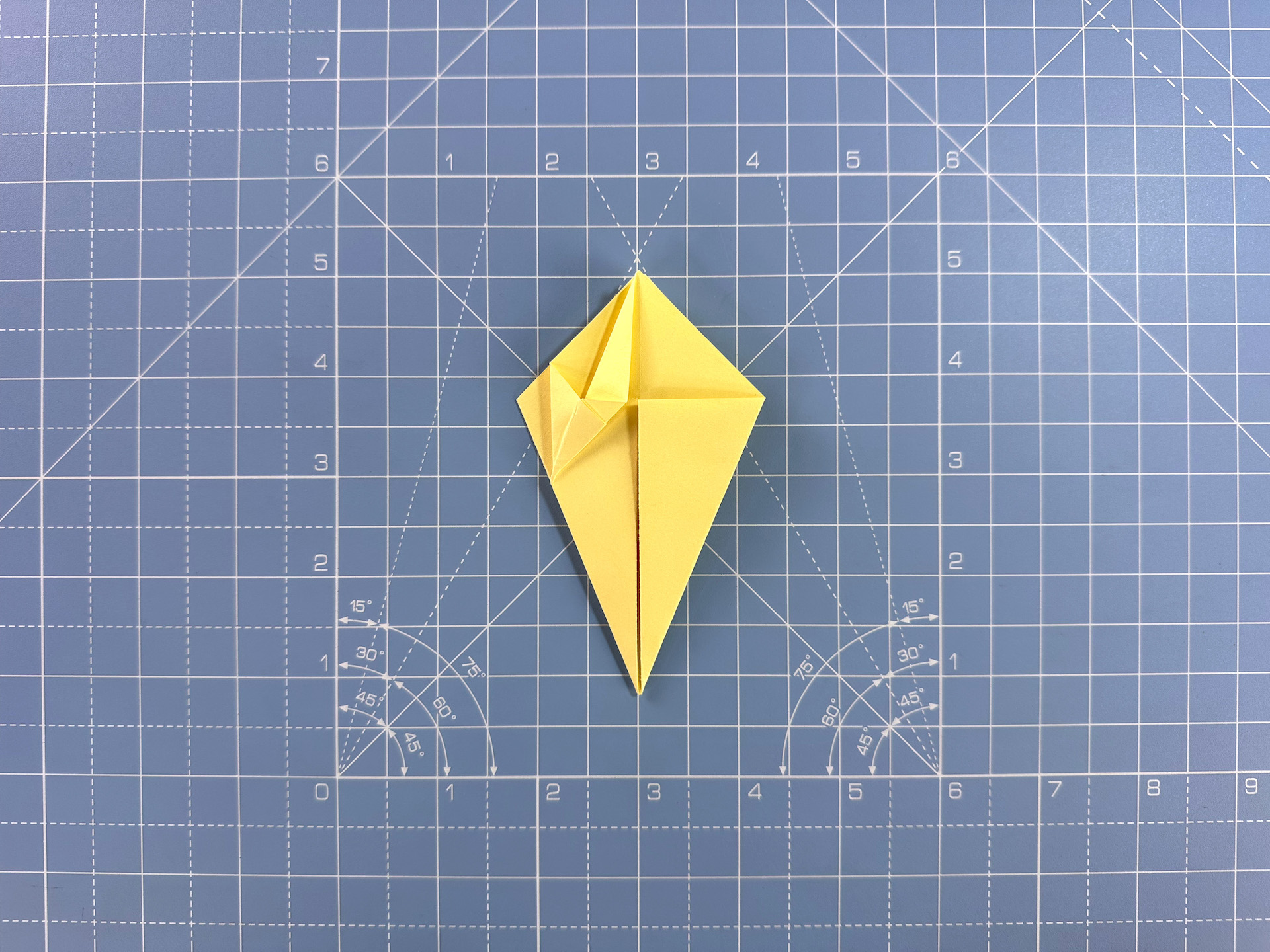 Making an origami flower bud step 18b