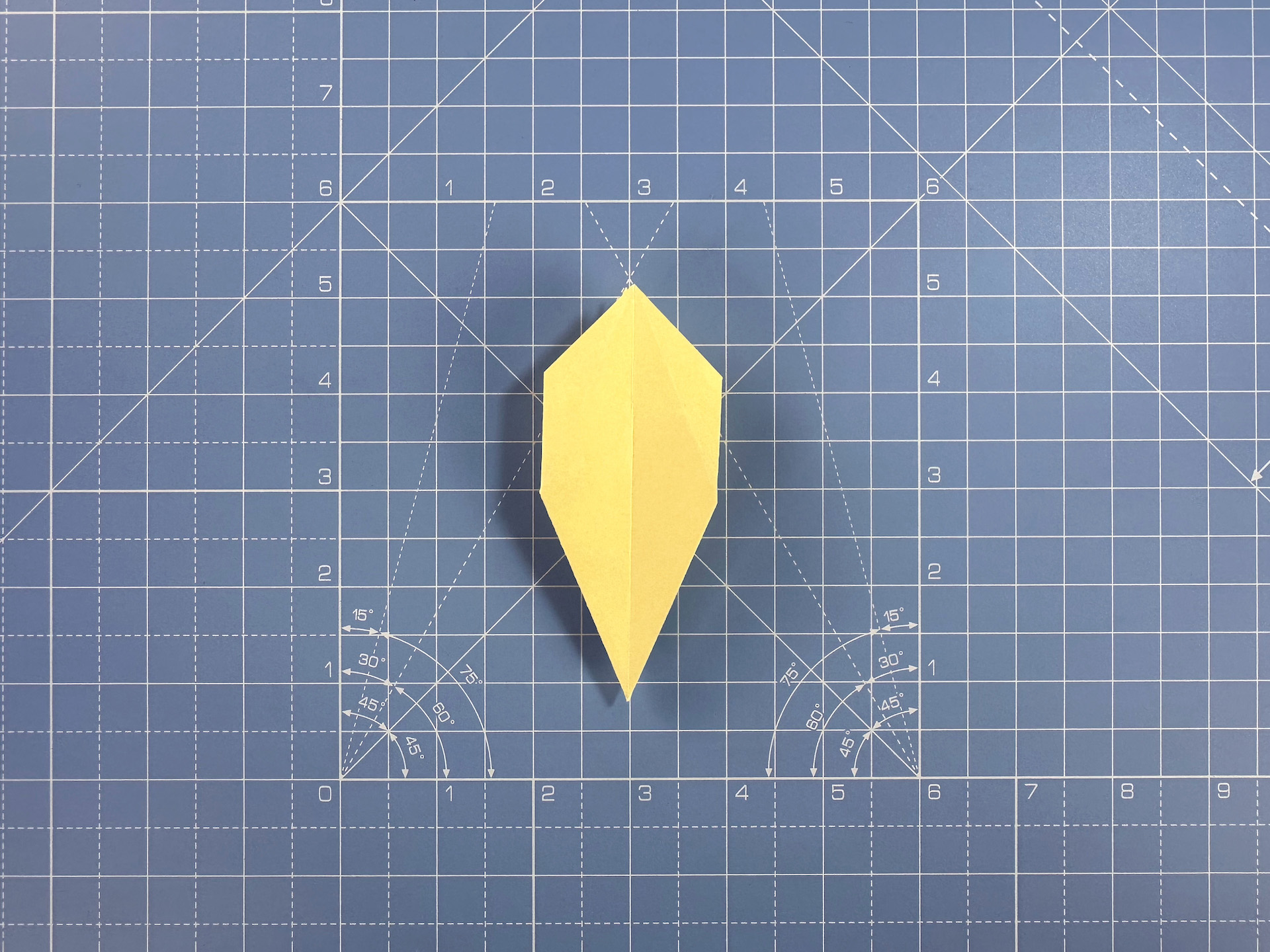 Making an origami flower bud step 20