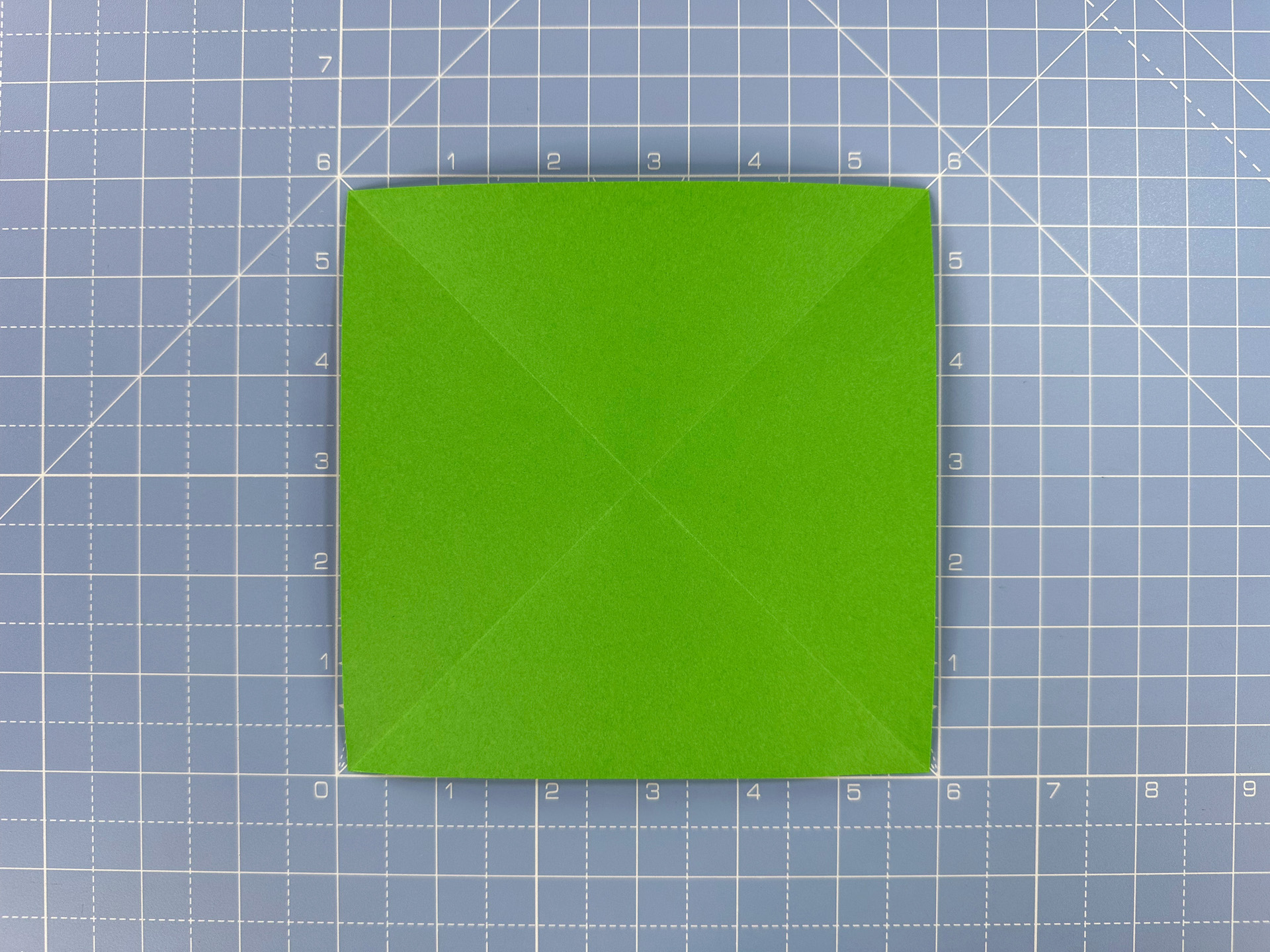 Making an origami flower bud step 24