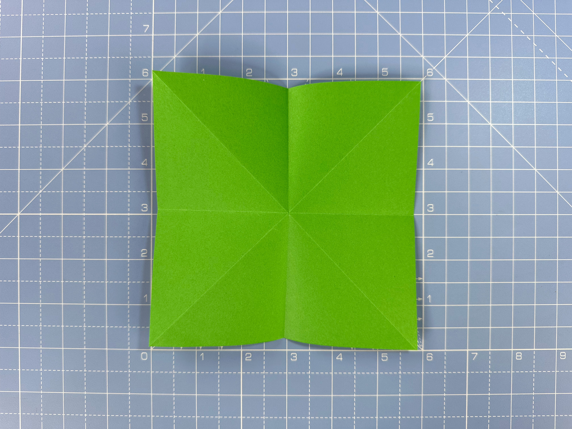 Making an origami flower bud step 25