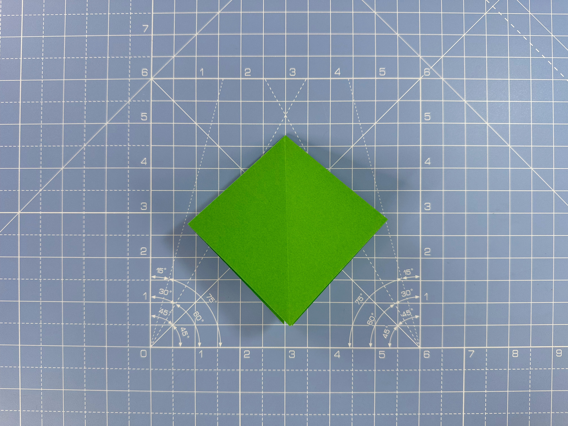 Making an origami flower bud step 26c