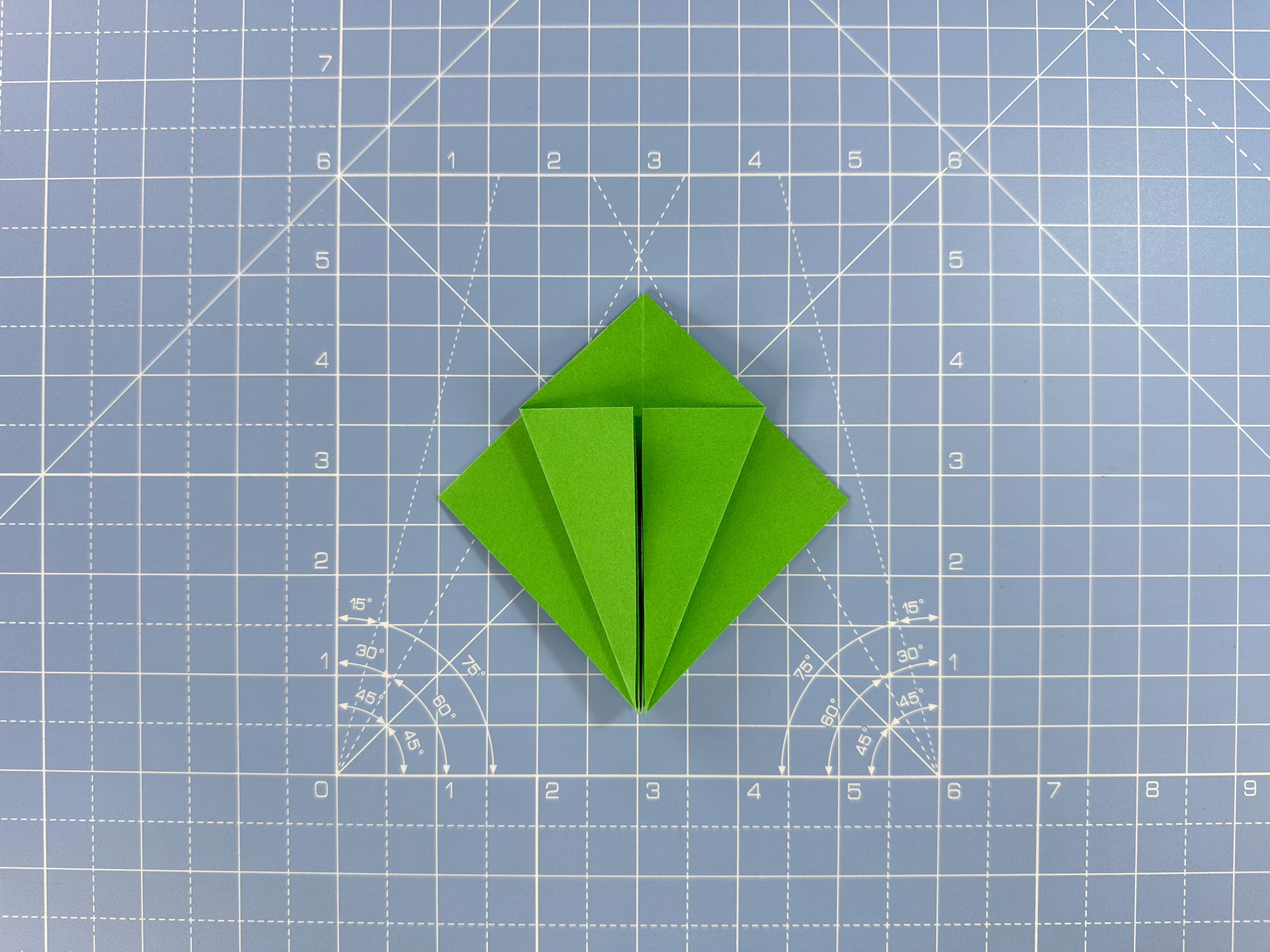 Making an origami flower bud step 27
