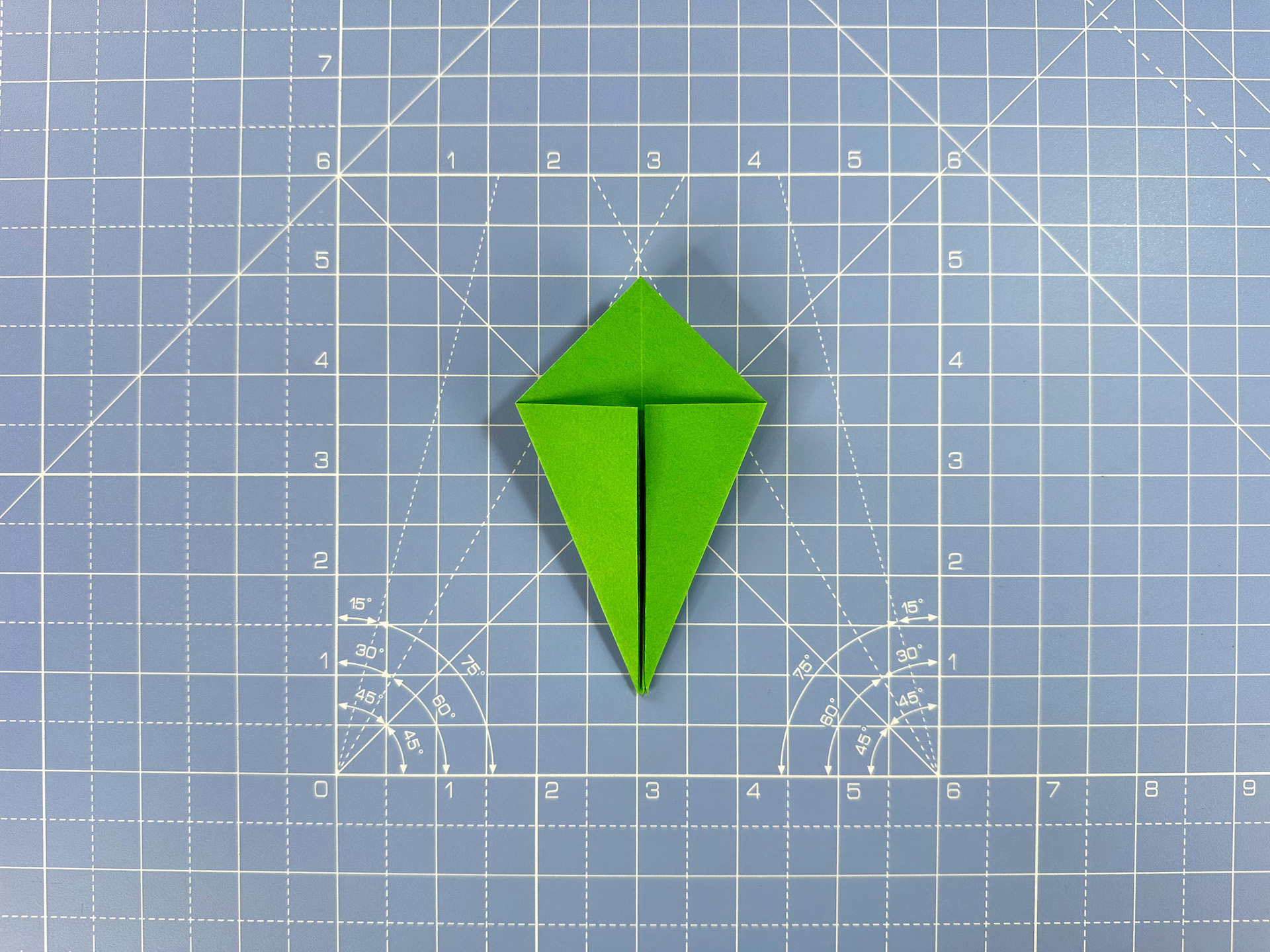 Making an origami flower bud step 28