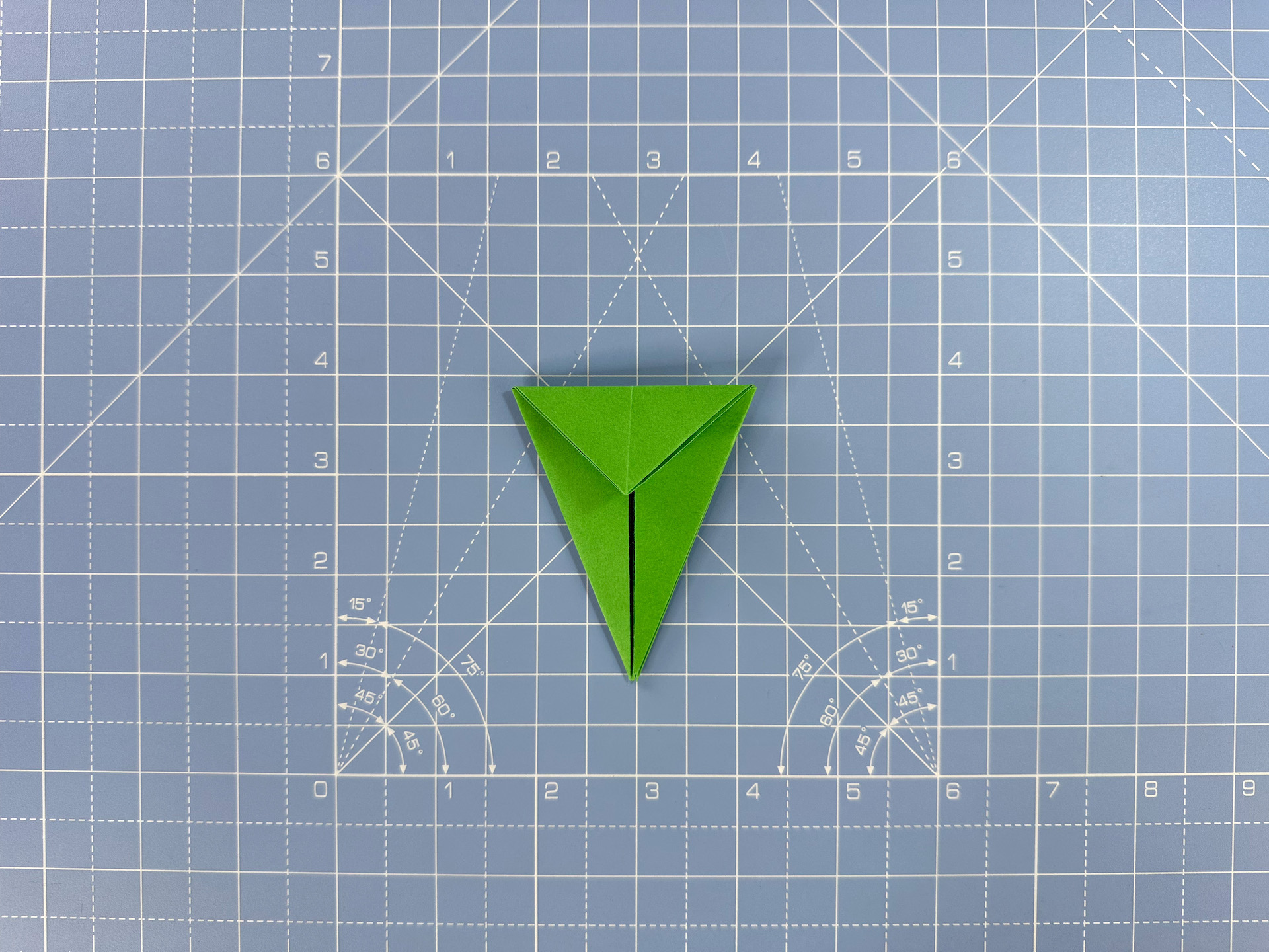 Making an origami flower bud step 29