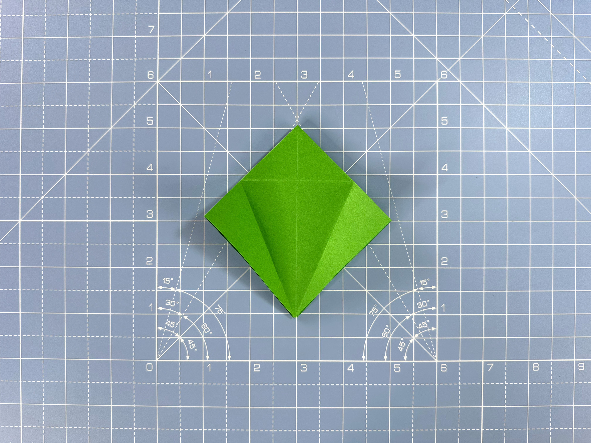 Making an origami flower bud step 30