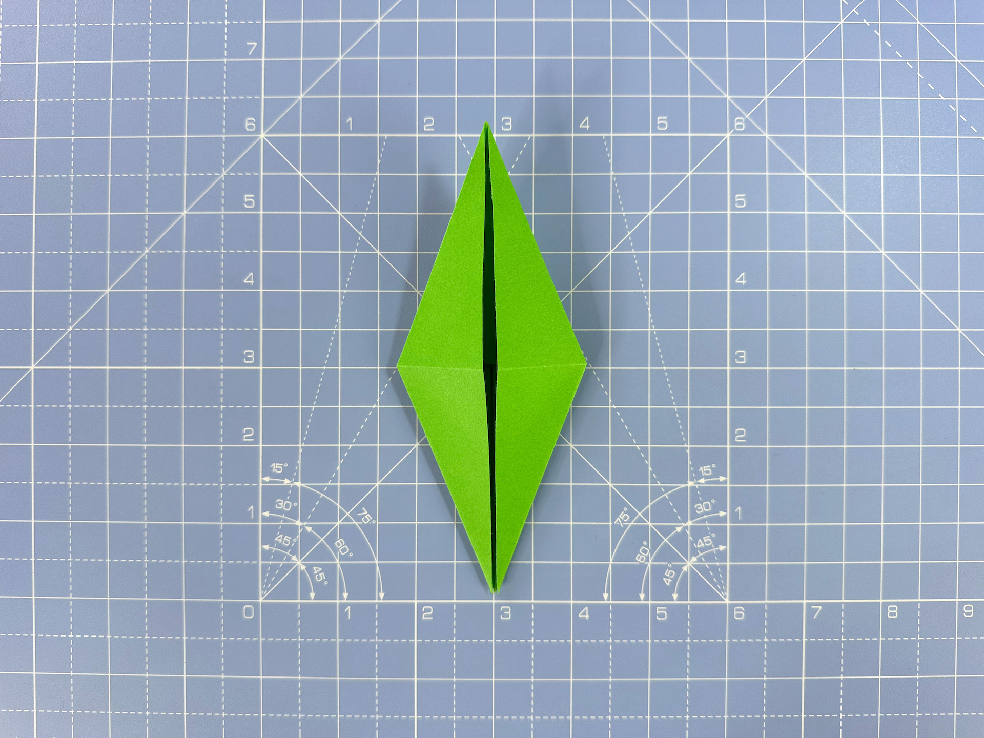 Making an origami flower bud step 31
