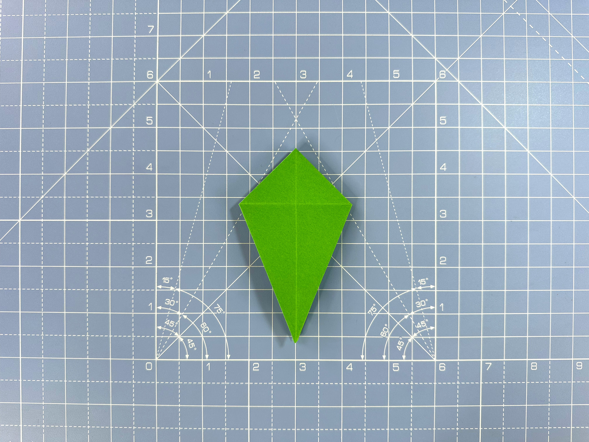 Making an origami flower bud step 32