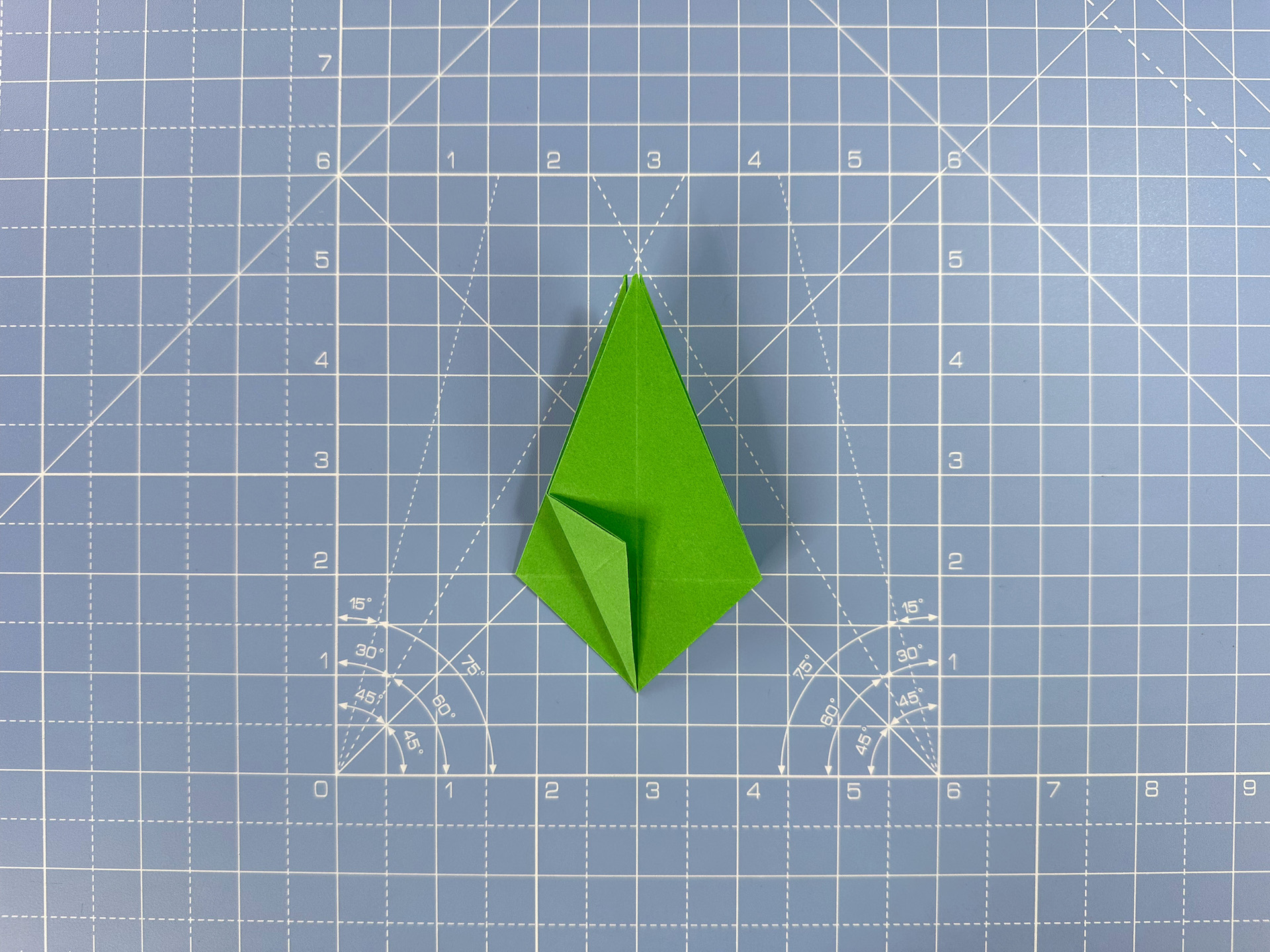 Making an origami flower bud step 33