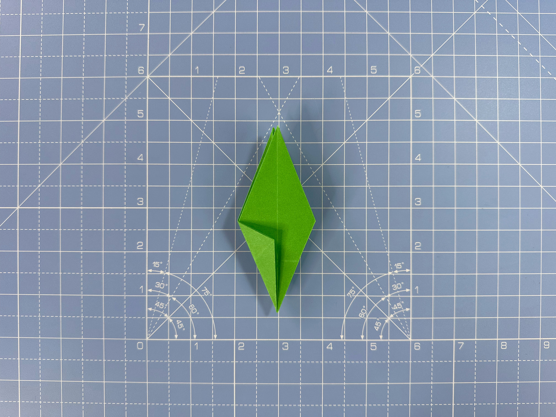 Making an origami flower bud step 34