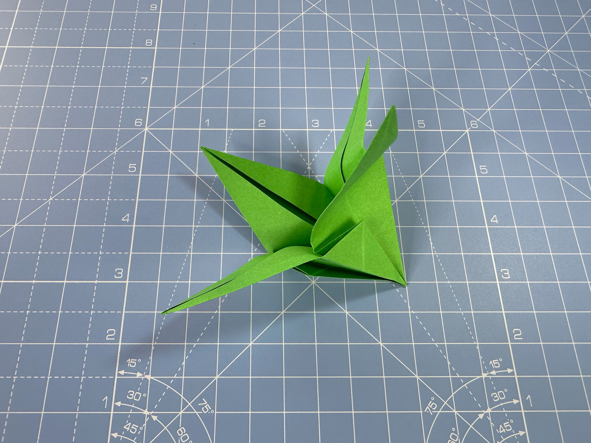 Making an origami flower bud step 35
