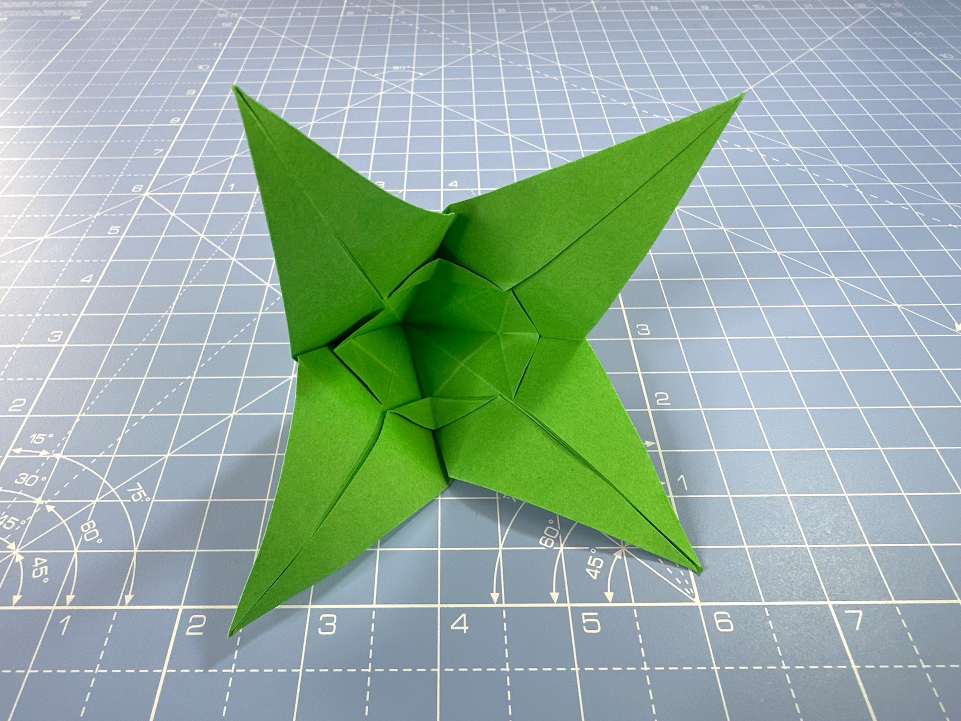 Making an origami flower bud step 36