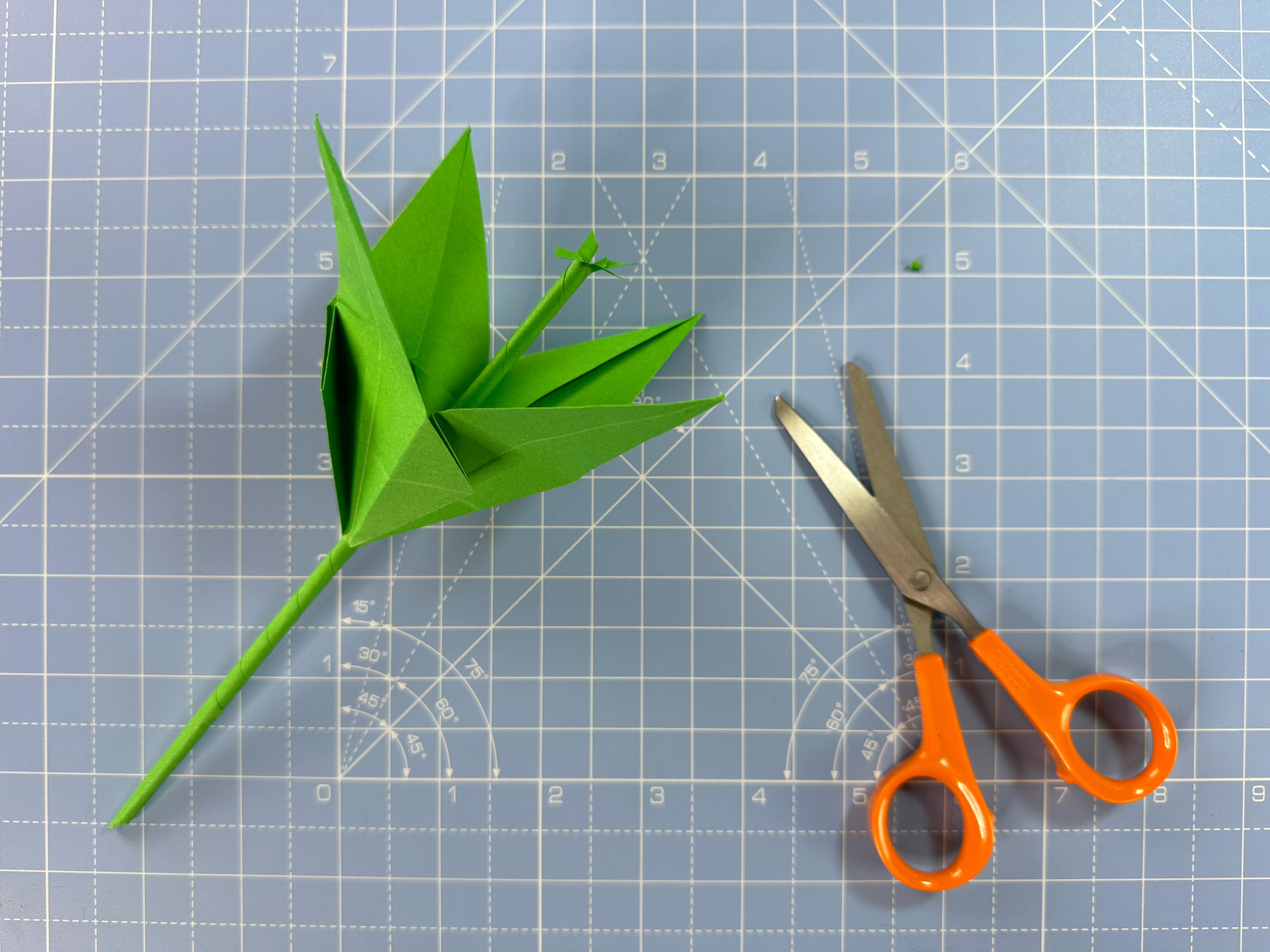Making an origami flower bud step 37a