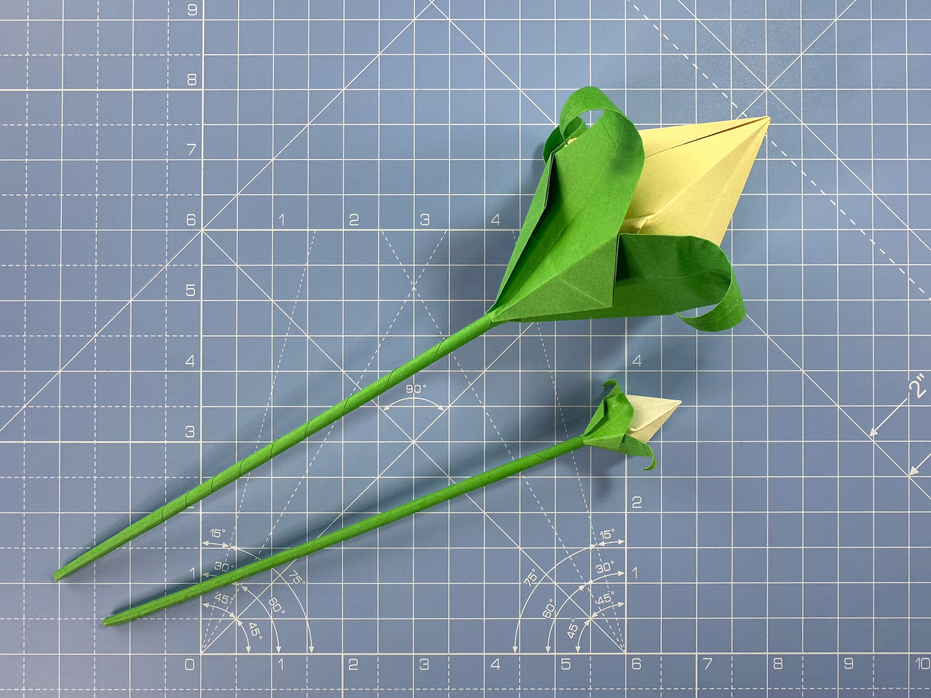 Making an origami flower bud step 38