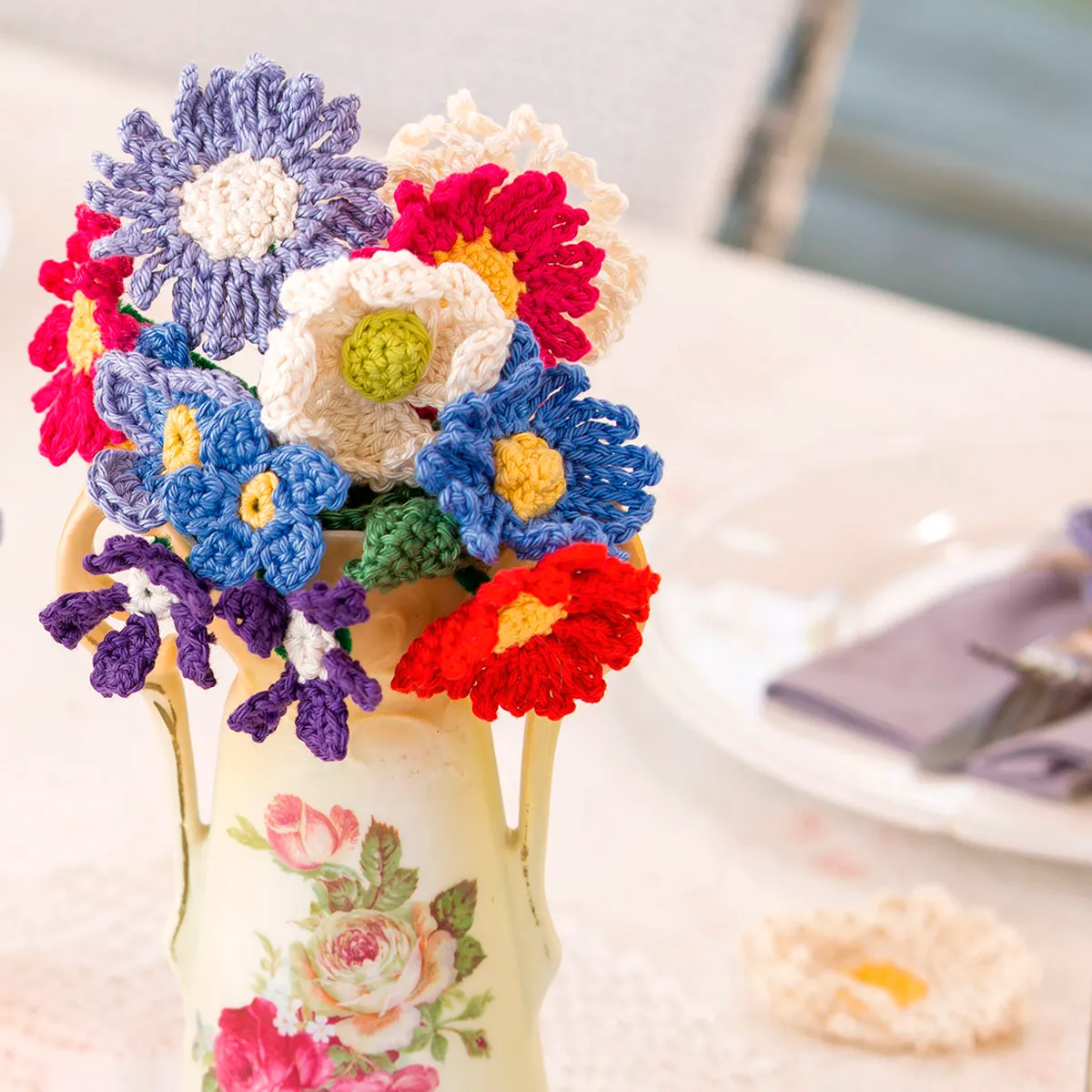 Crochet bouquet of flowers in a vase