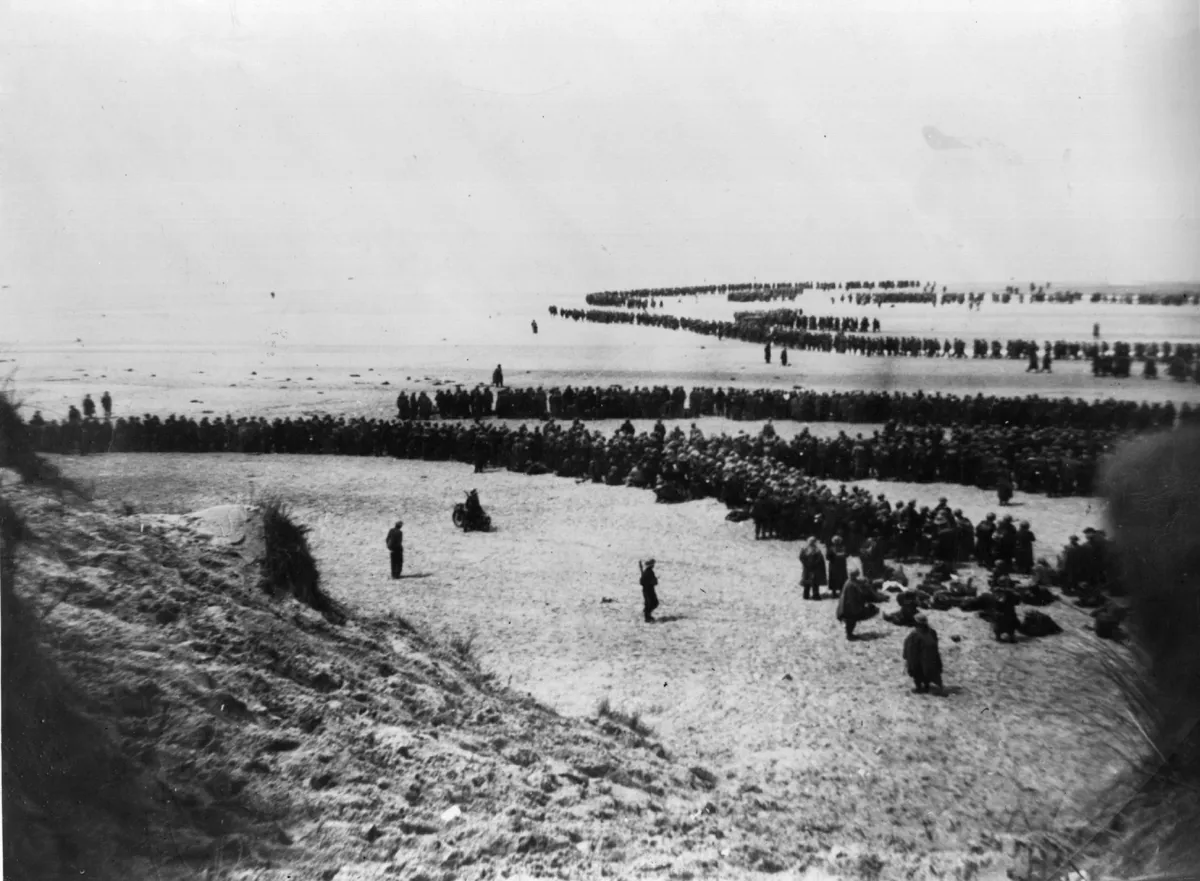 Defeated British and French troops waiting on the dunes at Dunkirk to be picked up by the Destroyers and taken back to England. (Photo by Topical Press Agency/Getty Images)