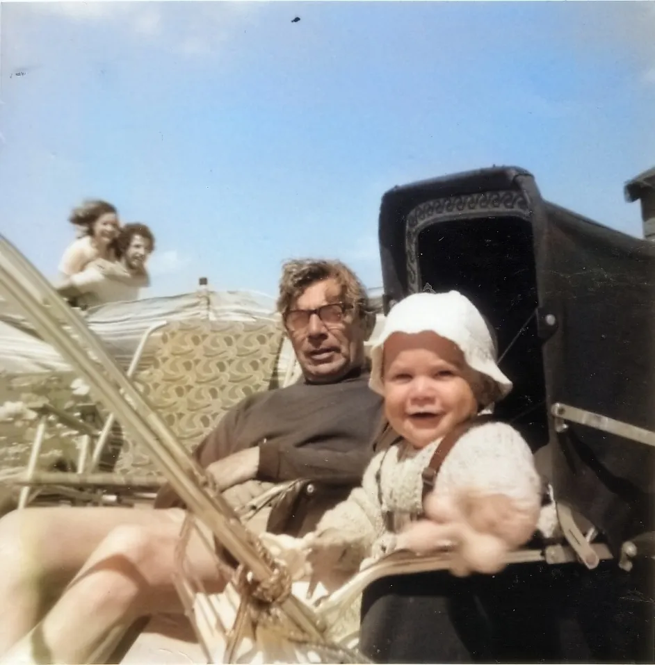 Colourised baby in pram with grandfather