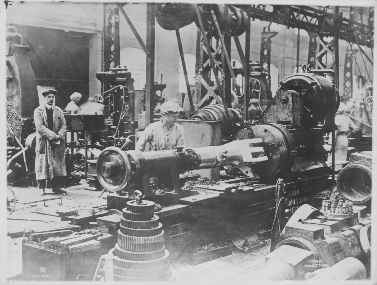 Men and women in a munitions factory
