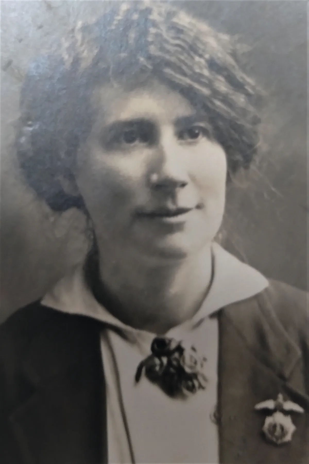 A black and white photograph of a young woman
