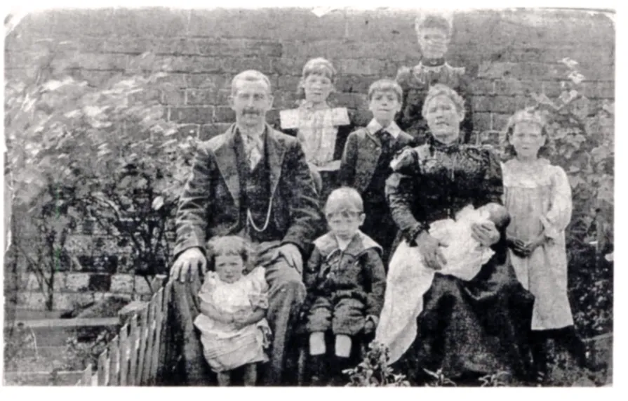 Black and white photograph of a family group in Edwardian clothes
