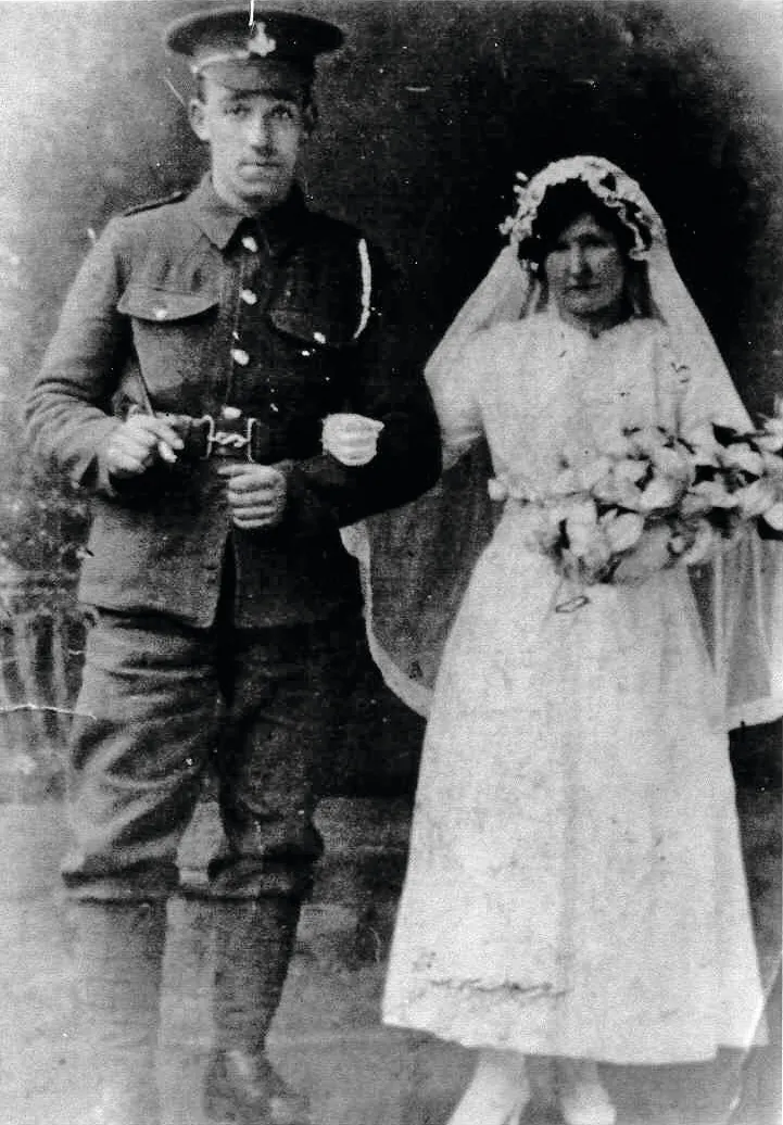 Black and white photograph of a bride and a groom in military uniform