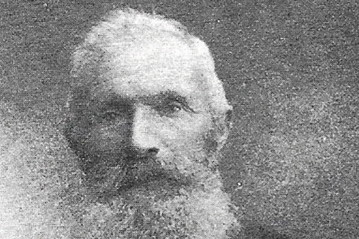 Black and white photograph of an old man with a white beard