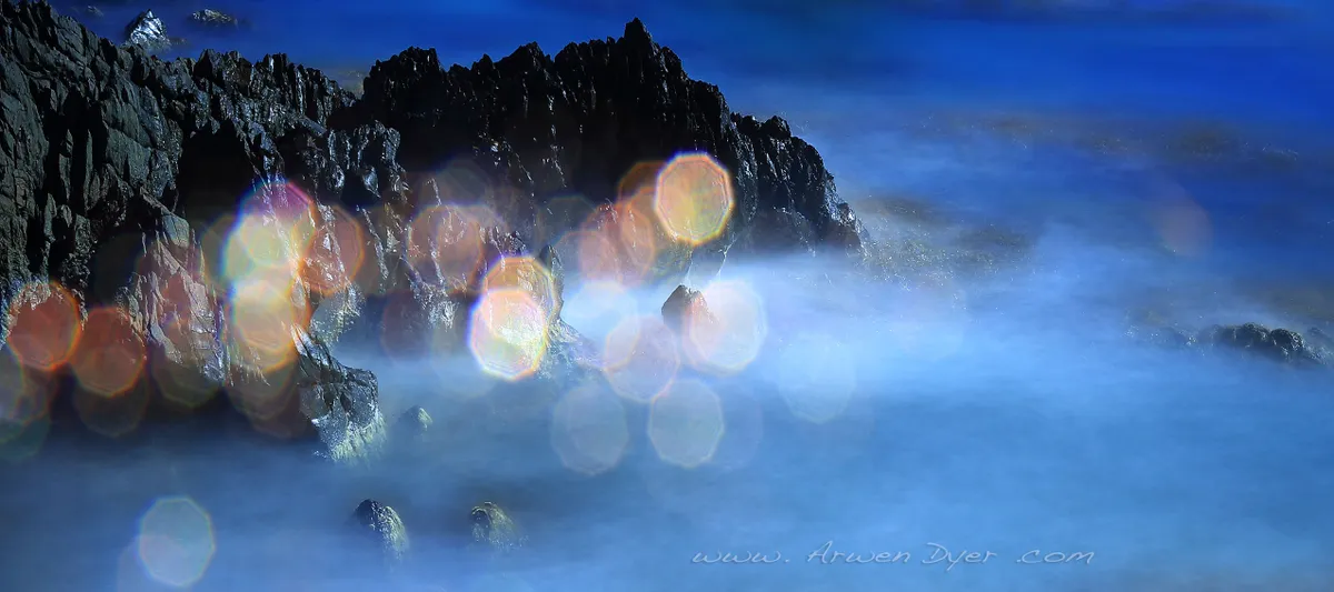 Lens glare creates an abstract effect in this coastal shot. © Arwen Dyer