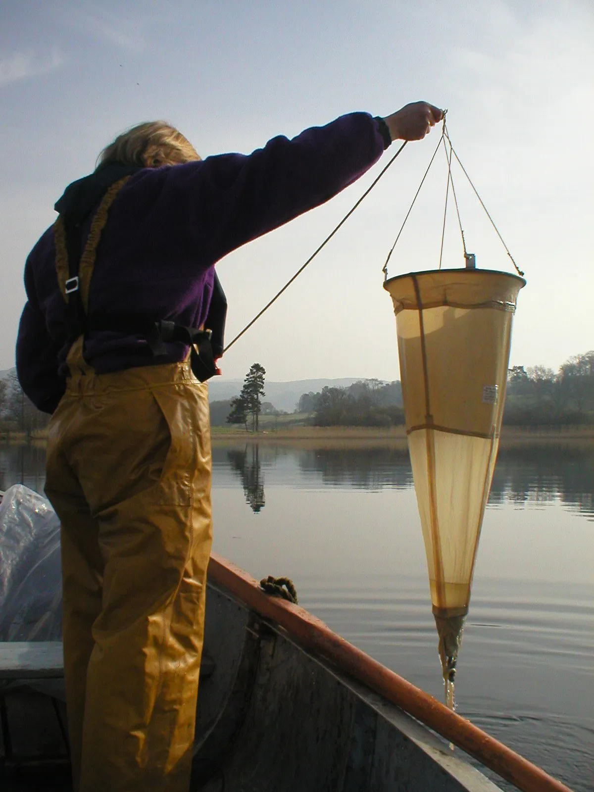 One of the team collecting samples from the Lake.