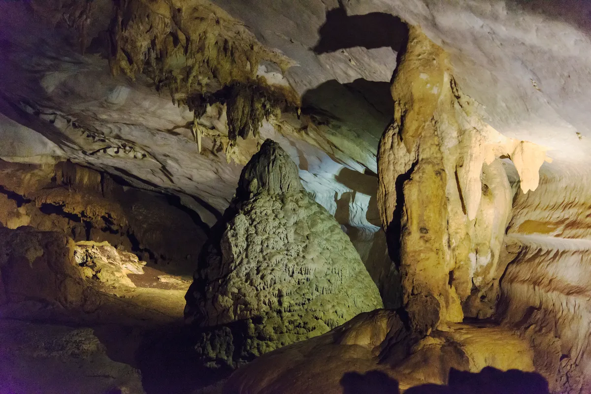 These dramatic stalactites and stalagmites can be found in Lang Cave, which is connected to the Deer Cave complex. © Emanuele Biggi and Francesco Tomasinelli.