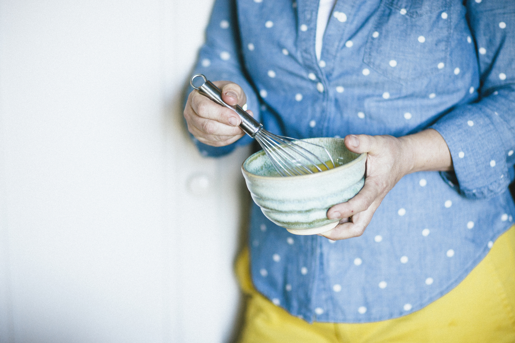 Mixing food in a bowl. © Karen Beard/Getty