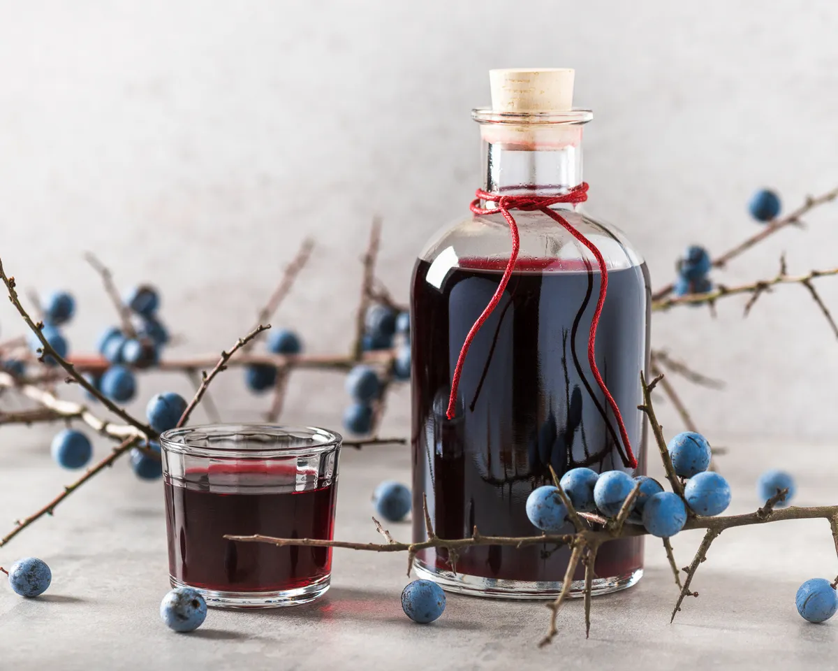 Why not give a handmade gift this year, perhaps using foraged fruit, such as this sloe port. Oksana Schmidt/Getty.