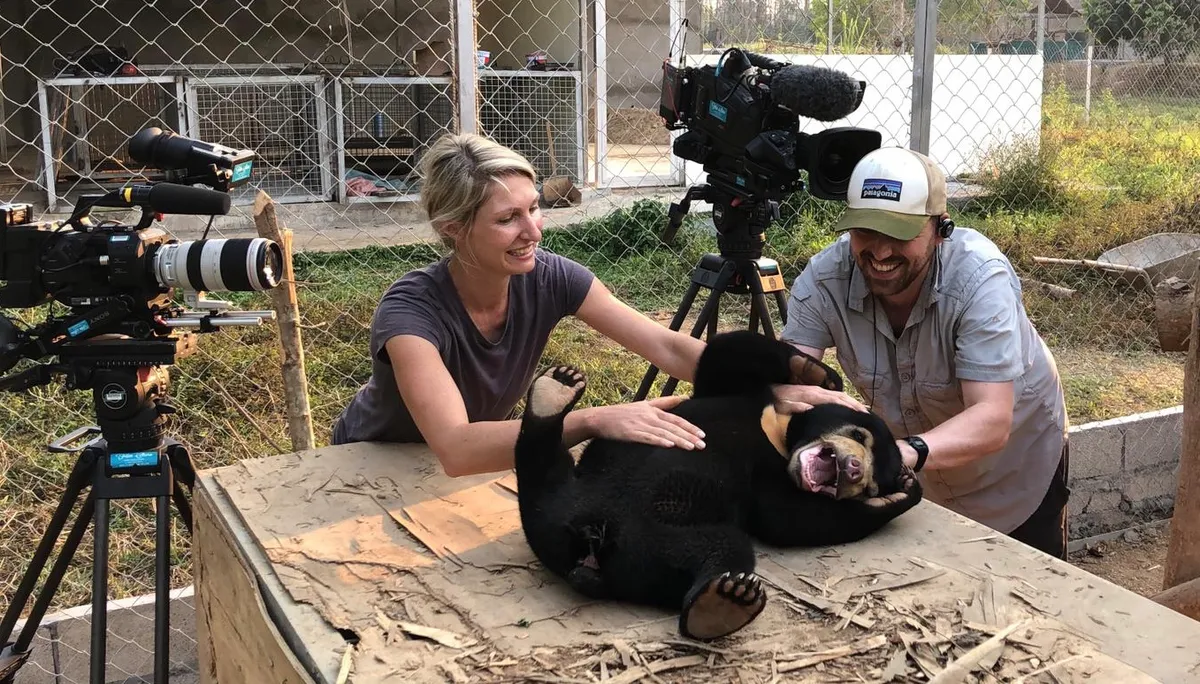 Behind the scenes crew trying to wrangle Mary the sun bear for filming.