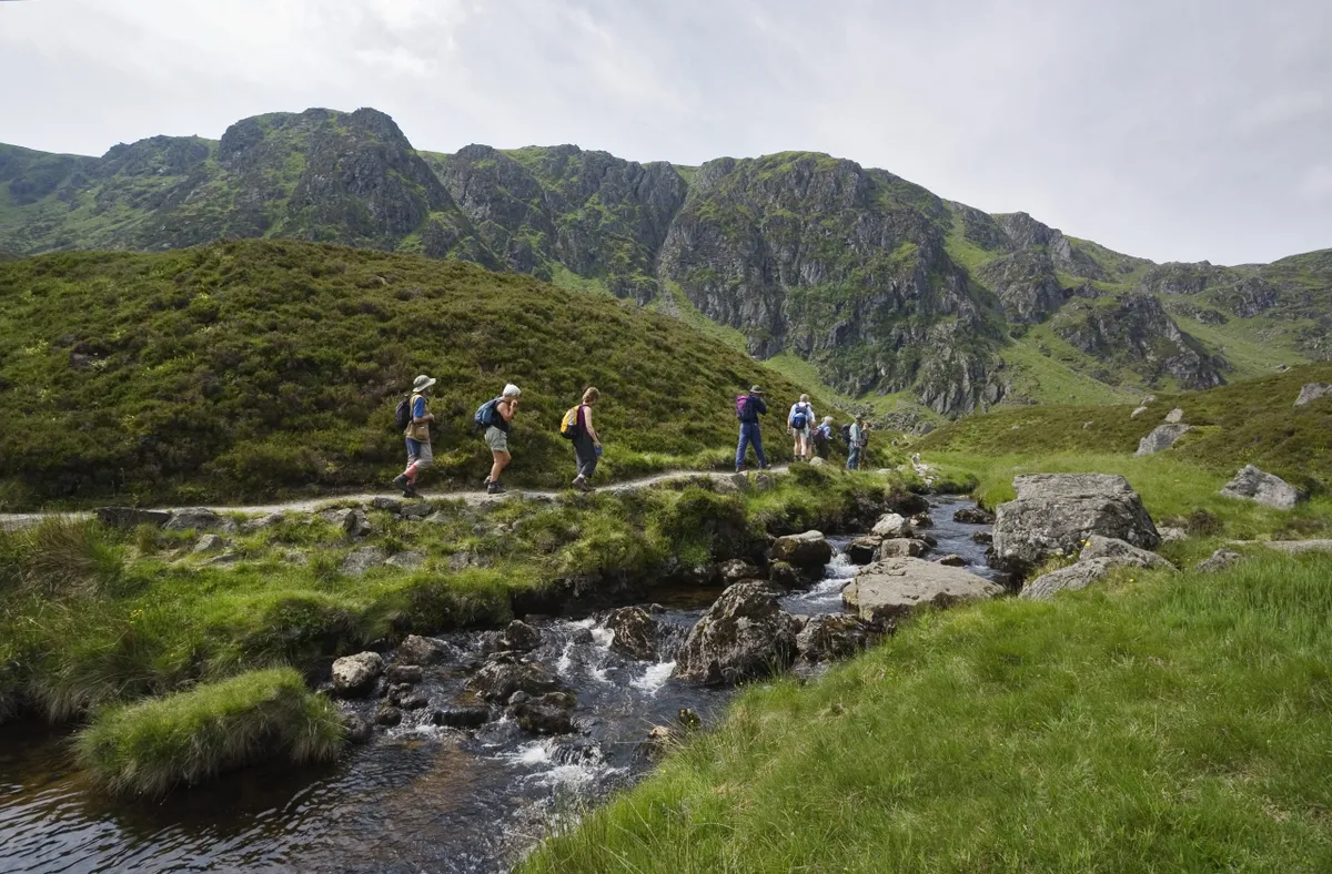 Walkers explore Corrie Fee National Nature Reserve/ Credit: Paul Tomkins, VisitScotland