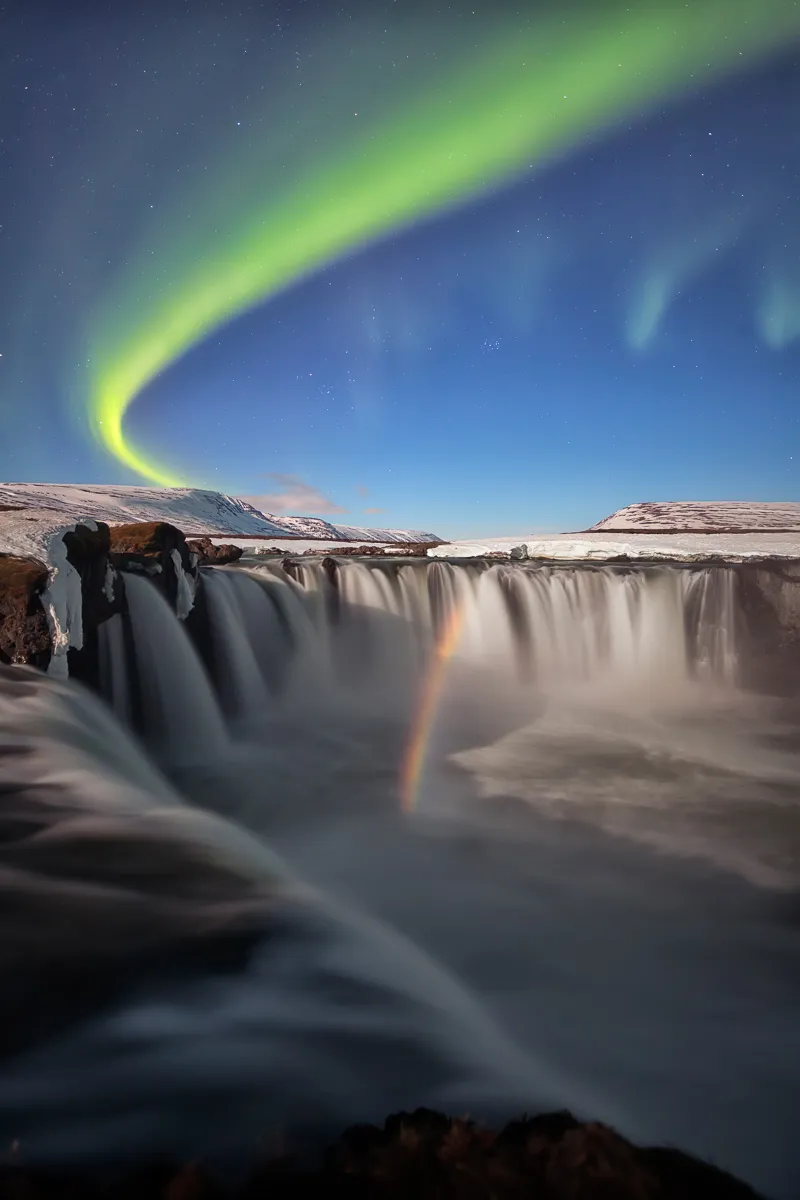This shot is a mix of magical elements: the light of the moon whose incidence at the right angles generates a magnificent rainbow, beautiful northen lights shot during just above the lunar rainbow itself and one of the most famous and spectacular waterfall in Iceland, Godafoss.