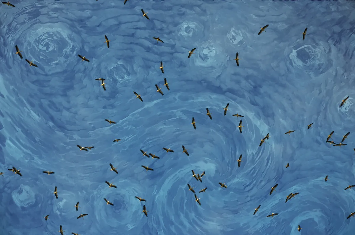 Storks against Van Gogh-like blue background.