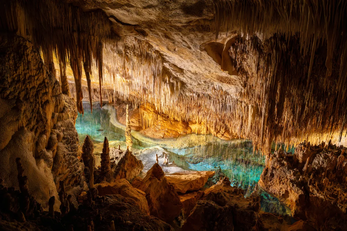 “Once they descend into the cave, they trudge 150m in the pitch black ...